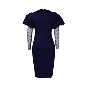 Detail view of navy blue dress back with polka dot mesh sleeves and concealed zipper