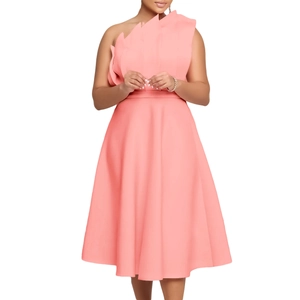 Detail of coral pink one-shoulder dress featuring sculptural asymmetric jagged neckline