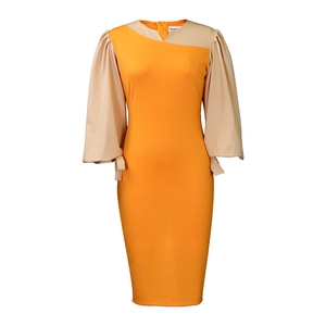 Detailed view of puff sleeves and orange-beige color blocking on the elegant dress