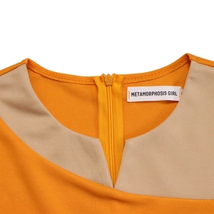 Close-up of color-block round neck with V-slit and orange zipper on a dress