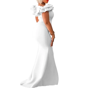 Detailed view of white off-the-shoulder gown with ruffled sleeves and mermaid cut style