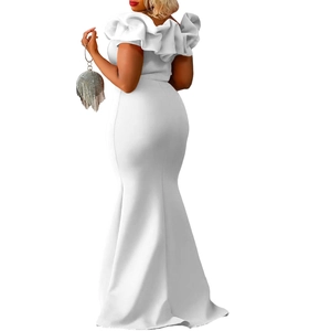 Detail of white off-shoulder evening gown featuring layered ruffle sleeves and mermaid cut