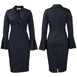 Detail view of black V-neck fitted dress with bell sleeves and floral neck ornament
