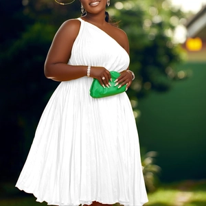 Detail of white one-shoulder pleated dress featuring lightweight layered fabric and drape