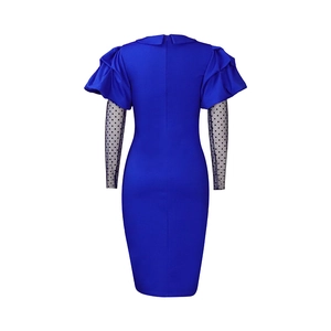 Detail view of the royal blue dress back with polka dot mesh sleeves and zipper