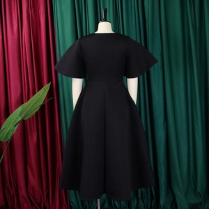 Detailed back view of a black V-neck dress with elegant flare sleeves and A-line silhouette