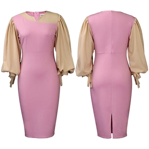 Detail view of pink bodycon dress featuring beige lantern sleeves and tie-up cuff design