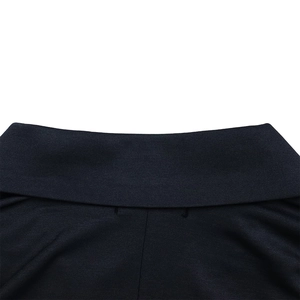 Detailed close-up of the V-neck ribbed fabric texture and fine stitching of the dress