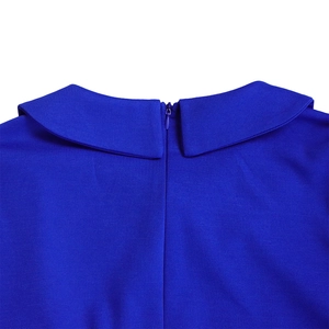 Detail of royal blue dress featuring Peter Pan collar and a hidden back zipper closure