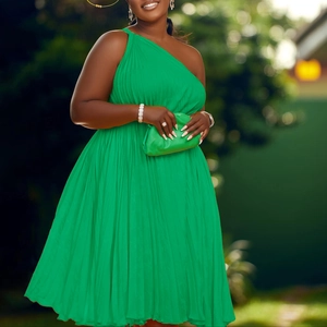 Detail of vibrant green one-shoulder pleated maxi dress with elegant waist tie