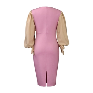 Back view of pink dress with beige lantern sleeves and invisible zipper detail