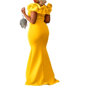 Detailed view of yellow fishtail dress featuring elegant layered ruffles and off-shoulder cut