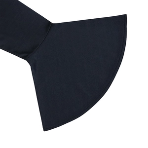 Close-up of elegant bell sleeves and textured twill fabric on a dark evening dress