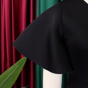 Detailed close-up of elegant black bell sleeves and high-quality fabric texture