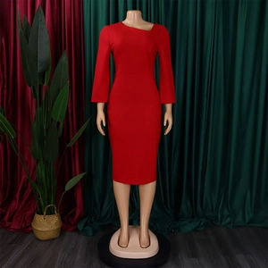 Detail of red fitted dress with unique asymmetric neckline and long sleeves on mannequin