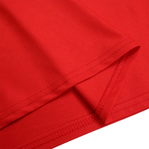 Detail of red high-elastic knit fabric with neat double-needle stitching and overlock edge