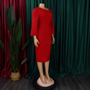 Detail of red slim-fit midi dress featuring an asymmetrical neckline and long sleeves