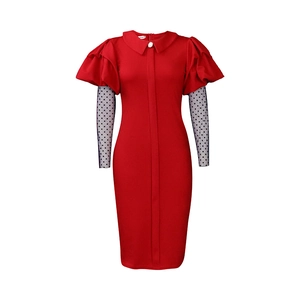 Detail of red fitted dress with puff shoulders and black polka dot mesh sleeves
