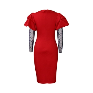 Back view of red fitted dress with invisible zipper and polka dot mesh long sleeves