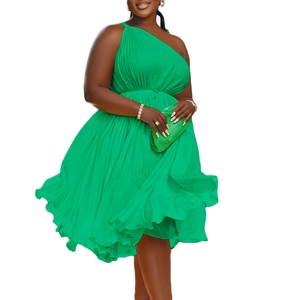 Detail showing high-quality pleats and one-shoulder cut on this bright green chiffon dress