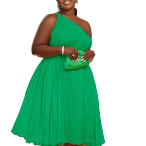 Detail of a bright green one-shoulder pleated maxi dress with fine vertical texture and flowy hem