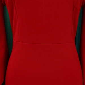 Close-up of red knitted dress waist seam with high-density fabric texture and stitching