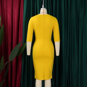 Detail view of yellow V-neck bodycon midi dress featuring back slit and invisible zipper