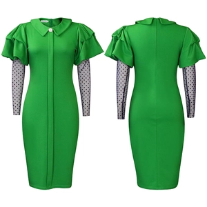Detail of green fitted dress with Peter Pan collar, pearl button and mesh sleeves