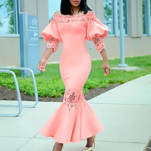 Close-up of elegant peach off-shoulder dress featuring intricate lace details and ruffles