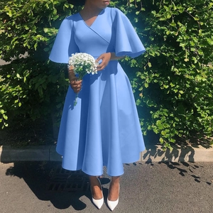 Detail of light blue V-neck dress with flare sleeves and elegant A-line pleated skirt
