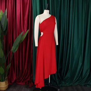 Detail of red one-shoulder hollow dress with asymmetric hem and flowing fabric texture