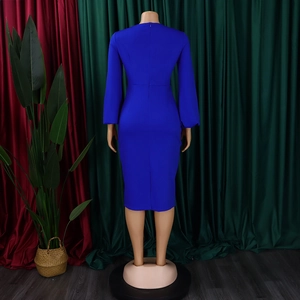 Detail of the hidden back zipper and fitted waist on a royal blue midi dress