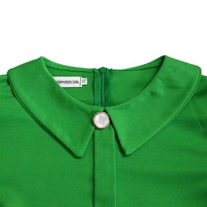 Detail of green mesh dress featuring Peter Pan collar with pearl button and back zipper