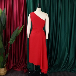 Detail of red one-shoulder dress with elegant cutout waist and asymmetrical hemline