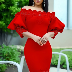 Detail of red off-shoulder dress featuring delicate lace trim and puffy bubble sleeves