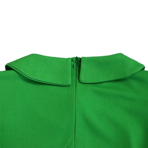 Detail of green mesh dress featuring a Peter Pan collar and hidden back zipper closure
