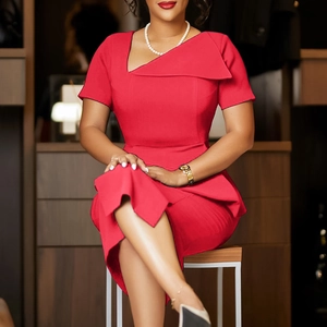 Detail of red slim-fit dress featuring an asymmetrical lapel collar and waist pleats