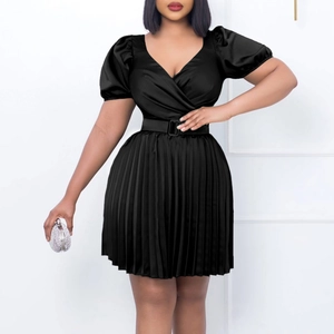 Detailed view of women's black V-neck pleated mini dress with elegant puff sleeves