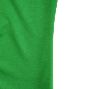 Close-up of grass green knitted mesh fabric showing the textured polyester blend material