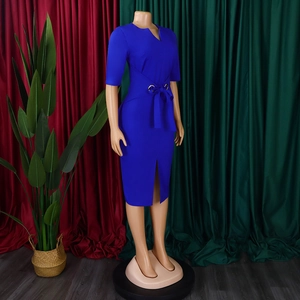 Detail of royal blue V-neck dress with waist tie and golden metal rings ornament