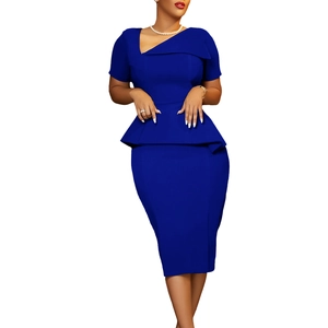 Detail of royal blue peplum dress featuring asymmetric neckline and tailored waist