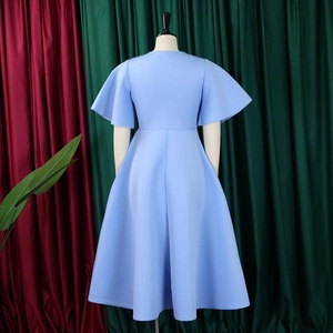 Detail of light blue A-line dress with elegant flare sleeves and structured silhouette