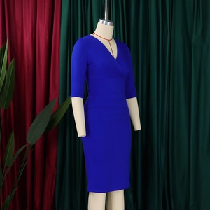 Detailed view of royal blue V-neck dress featuring elegant waist pleats on mannequin