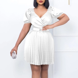 Detail of white V-neck pleated mini dress featuring puff sleeves and square buckle belt