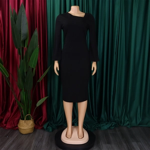 Detail of elegant black slim-fit dress featuring a unique asymmetrical geometric neckline