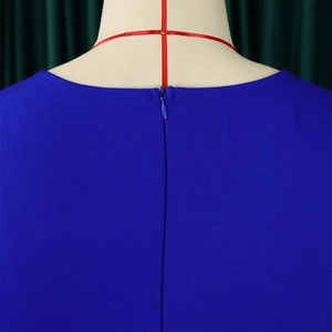 Detail view of the deep blue dress featuring a neat invisible back zipper and stitching