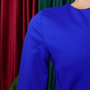 Detail of royal blue V-neck pencil dress featuring premium fabric and elegant tailoring