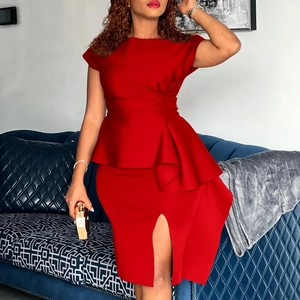 Detail view of red bodycon dress featuring peplum waist and side slit leg design