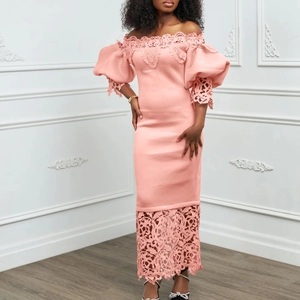Detailed view of pink off-shoulder dress featuring puffy lace sleeves and hem embroidery