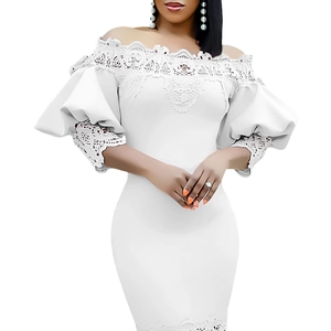 Close-up of white off-the-shoulder dress featuring intricate lace embroidery and puff sleeves